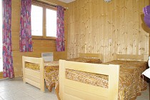 Chalet Andreas en Jacobin slaapkamer met 2 1-persoonsbedden en raam